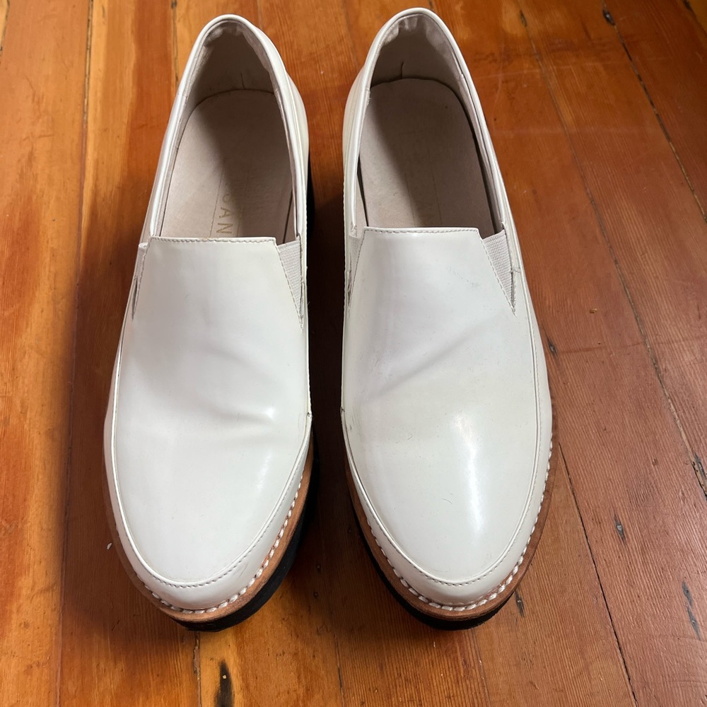 Gently worn. White patent platform loafer
